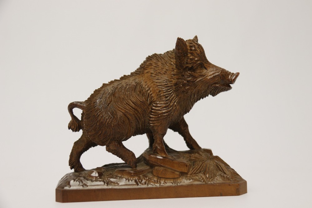 A fine Black Forest limewood carved study of a boar. View III