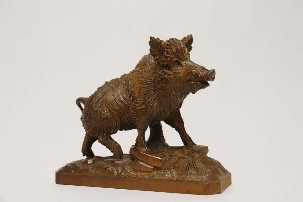 A fine Black Forest limewood carved study of a boar. View IV
