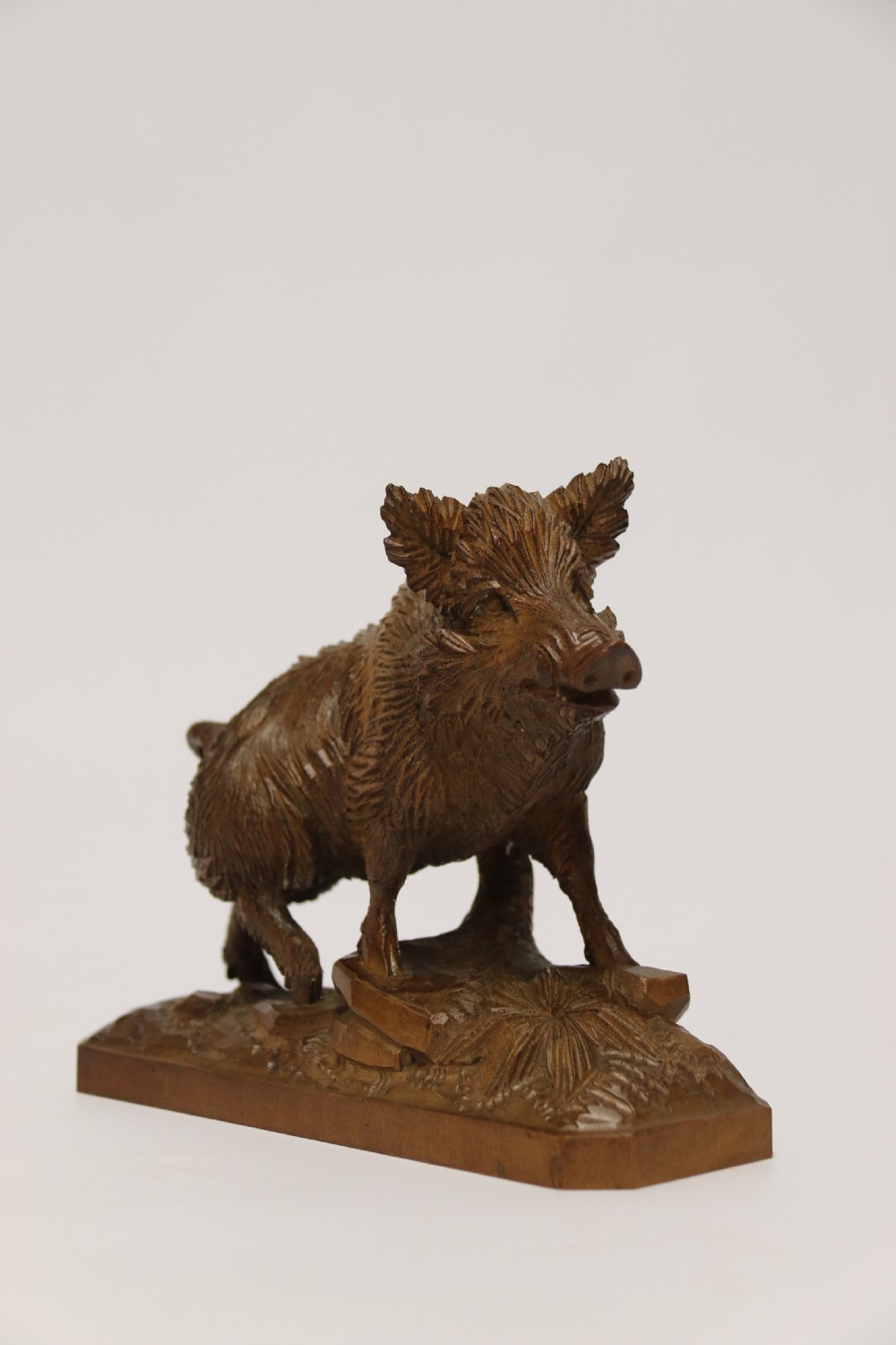A fine Black Forest limewood carved study of a boar. View V