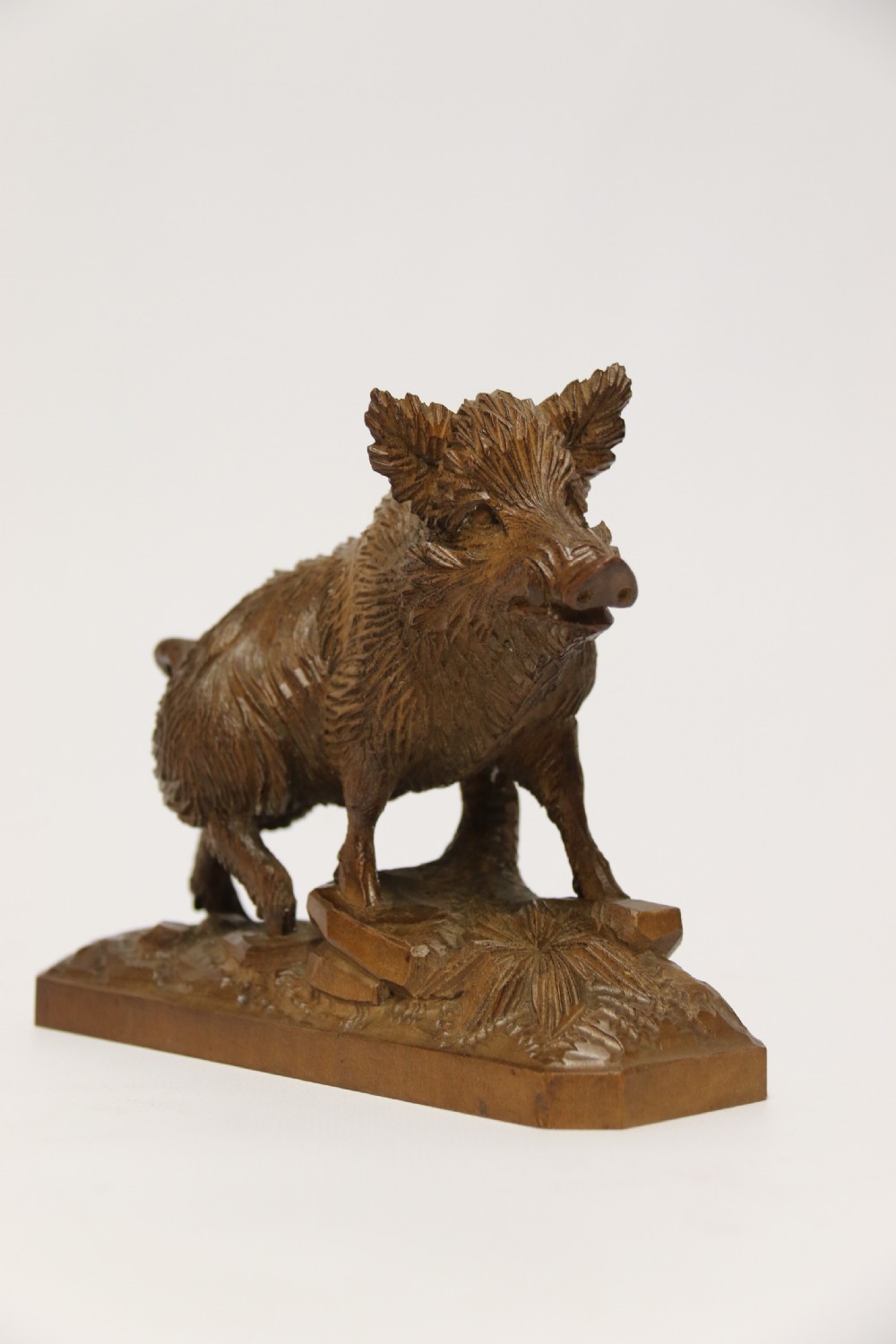 A fine Black Forest limewood carved study of a boar. View VI