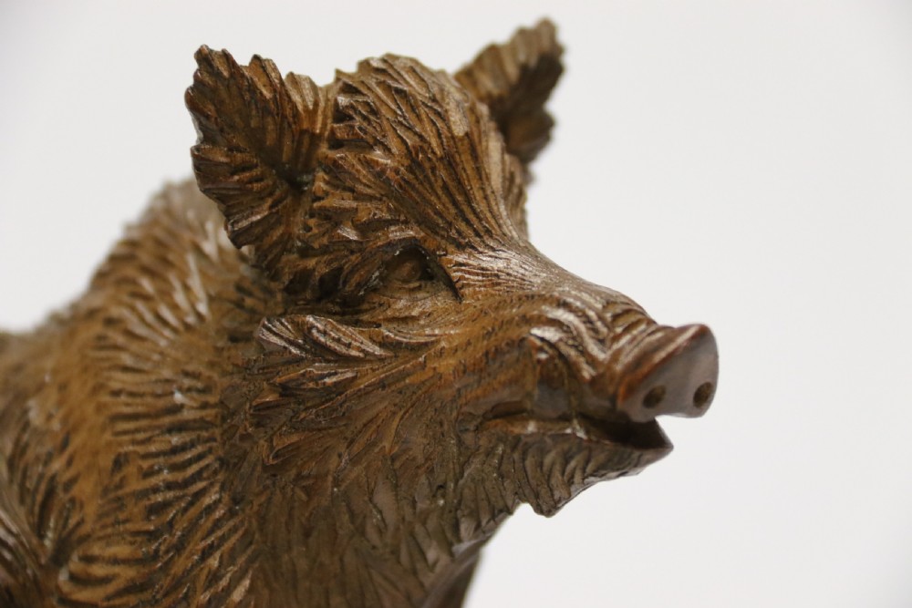 A fine Black Forest limewood carved study of a boar. View XI