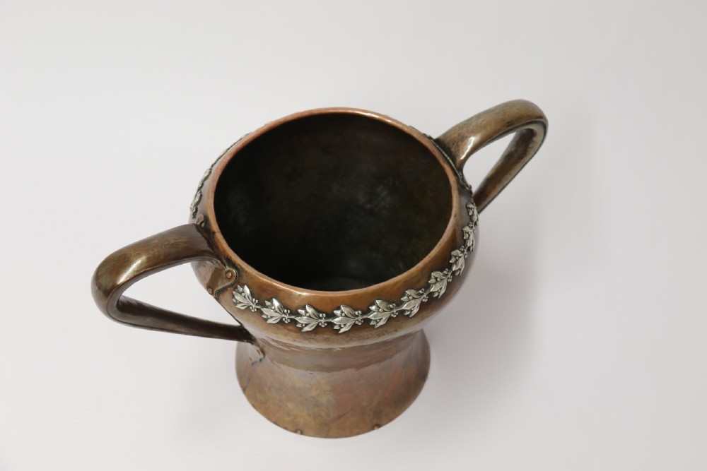 A fine copper and silver mounted Arts and Crafts vase by A E Jones View IX