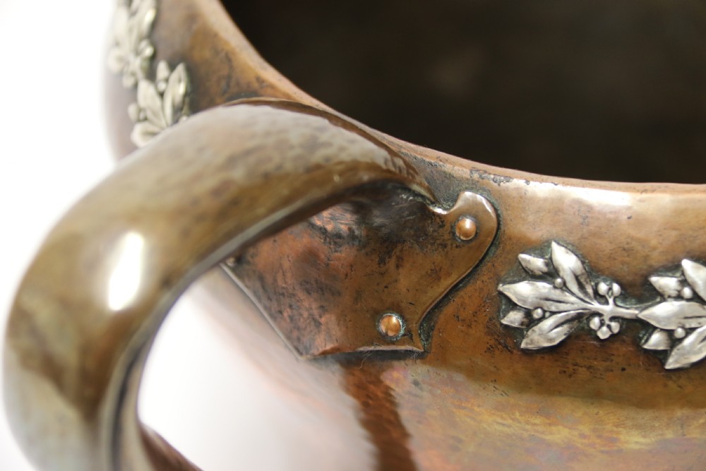 A fine copper and silver mounted Arts and Crafts vase by A E Jones View XI