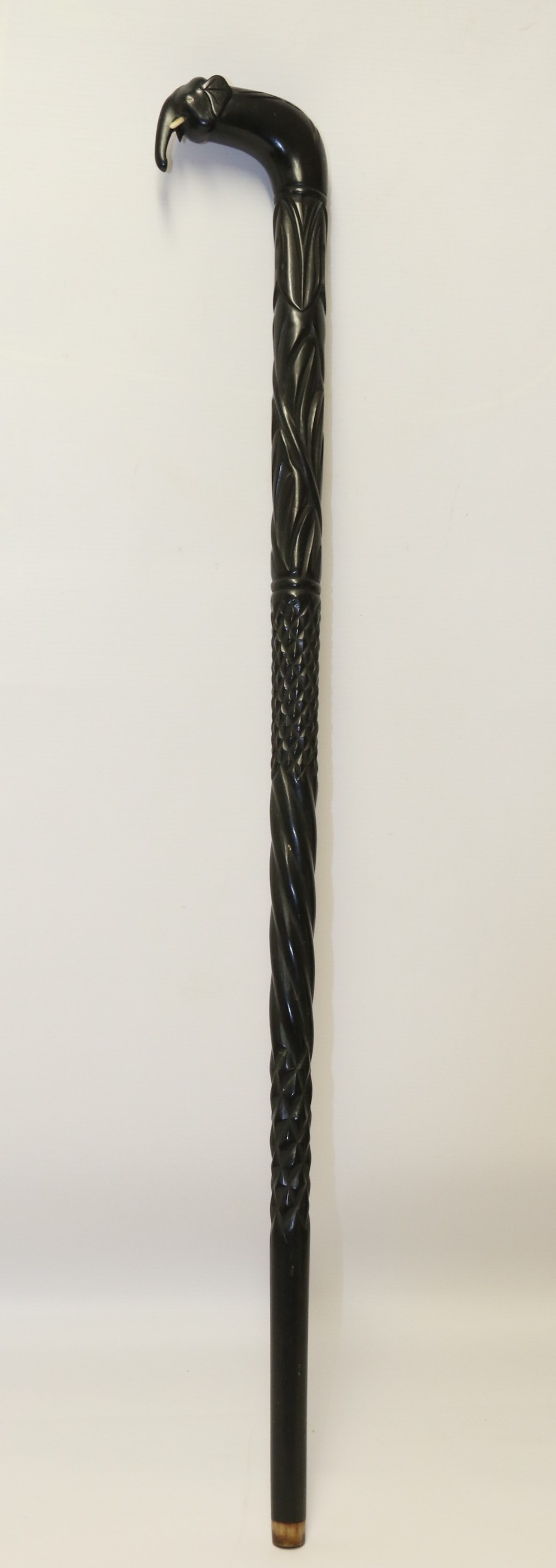 A decorative Raj period Indian carved ebony walking stick