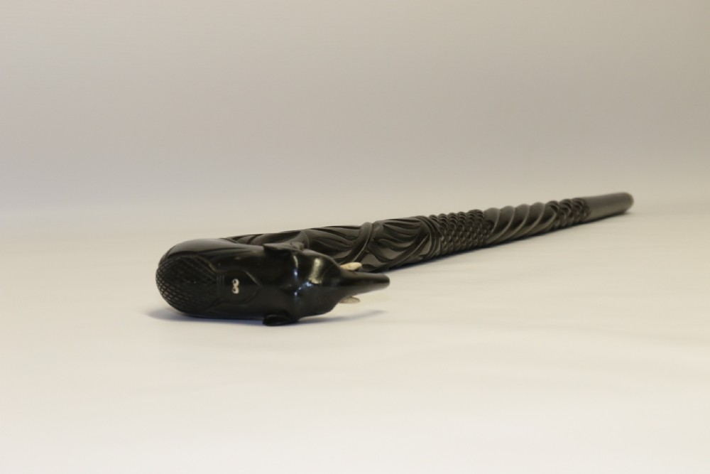 A decorative Raj period Indian carved ebony walking stick View II