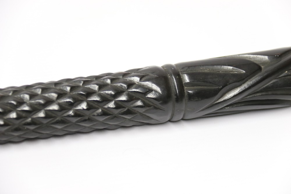 A decorative Raj period Indian carved ebony walking stick View XXII