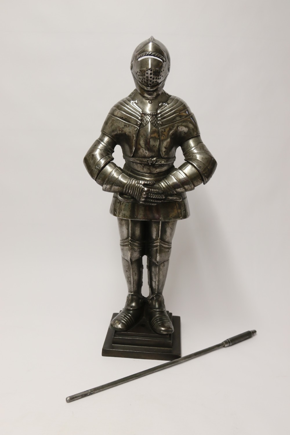 An impressive fire side poker stand in the form of a medieval knight View II