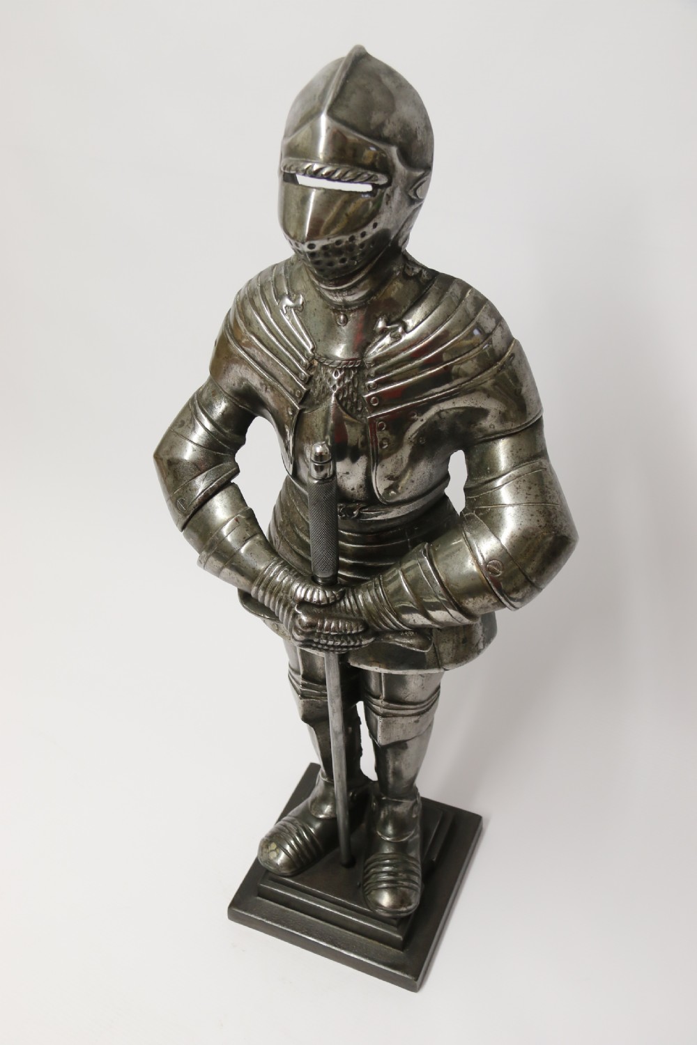 An impressive fire side poker stand in the form of a medieval knight View III