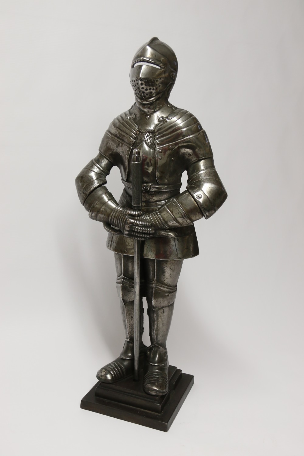 An impressive fire side poker stand in the form of a medieval knight View V