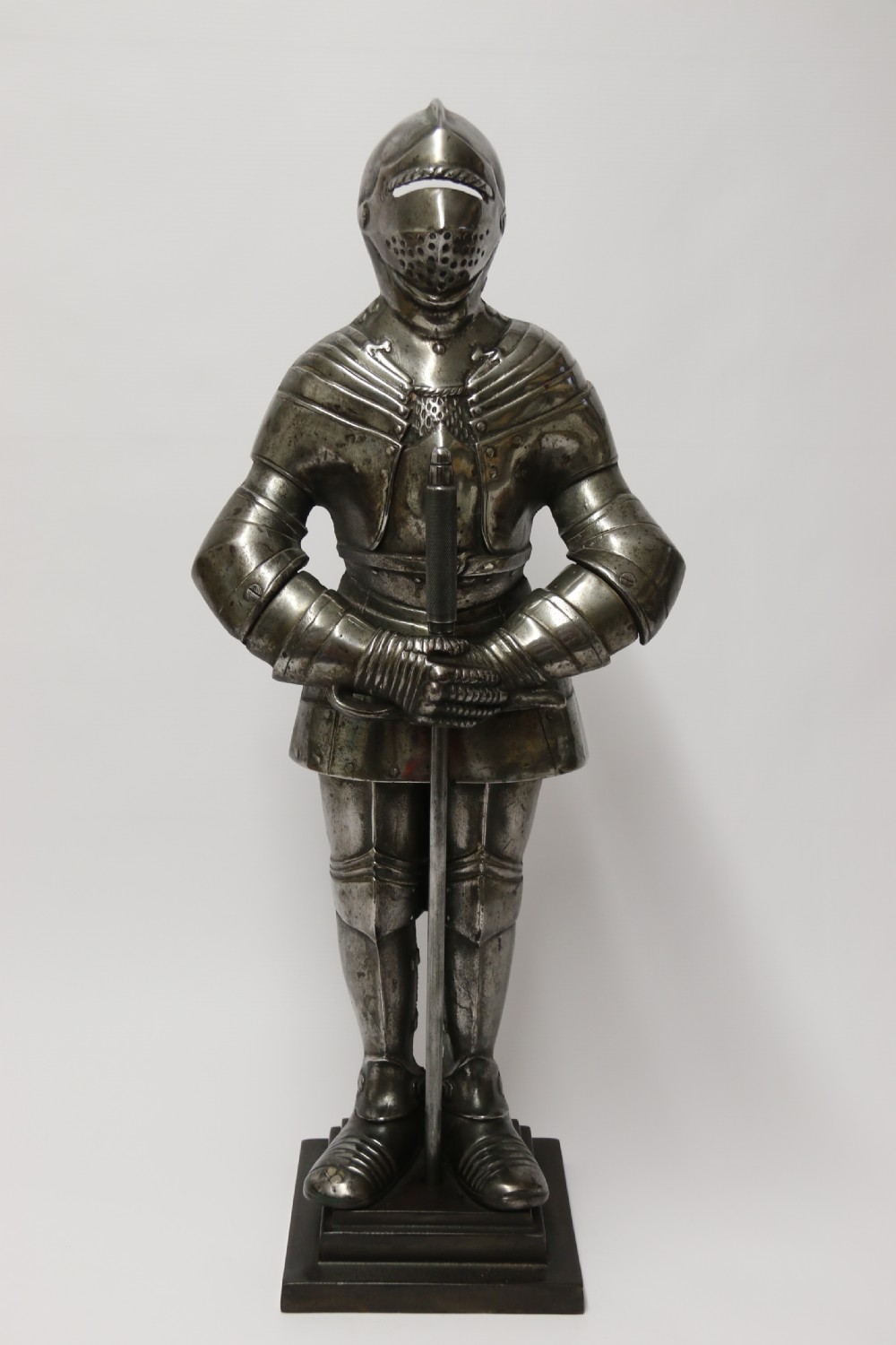 An impressive fire side poker stand in the form of a medieval knight View VI