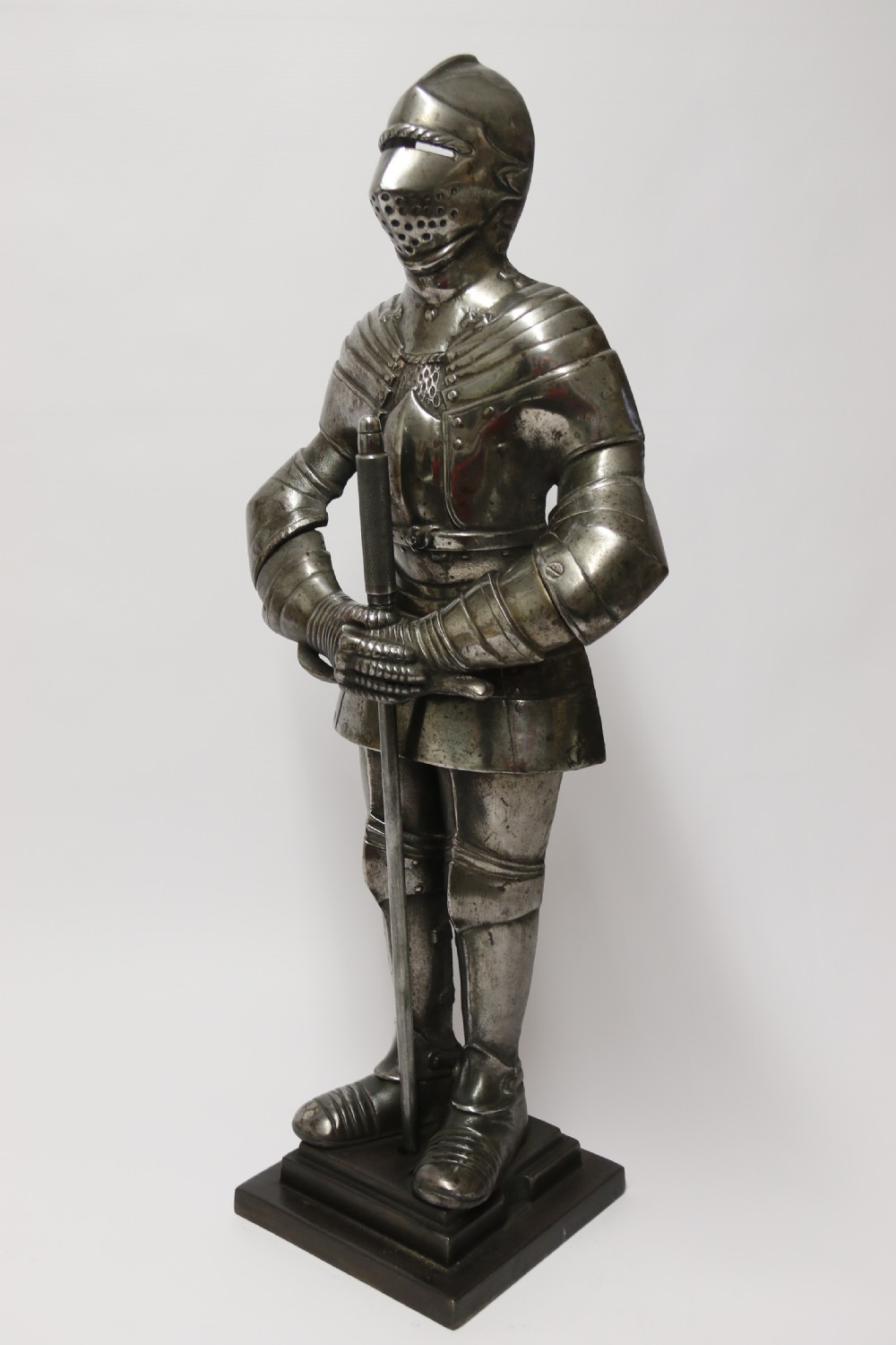 An impressive fire side poker stand in the form of a medieval knight View VII