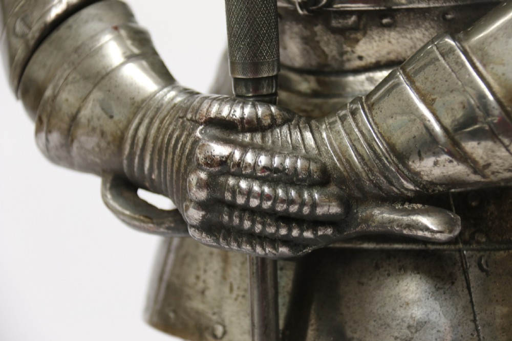 An impressive fire side poker stand in the form of a medieval knight View XIII