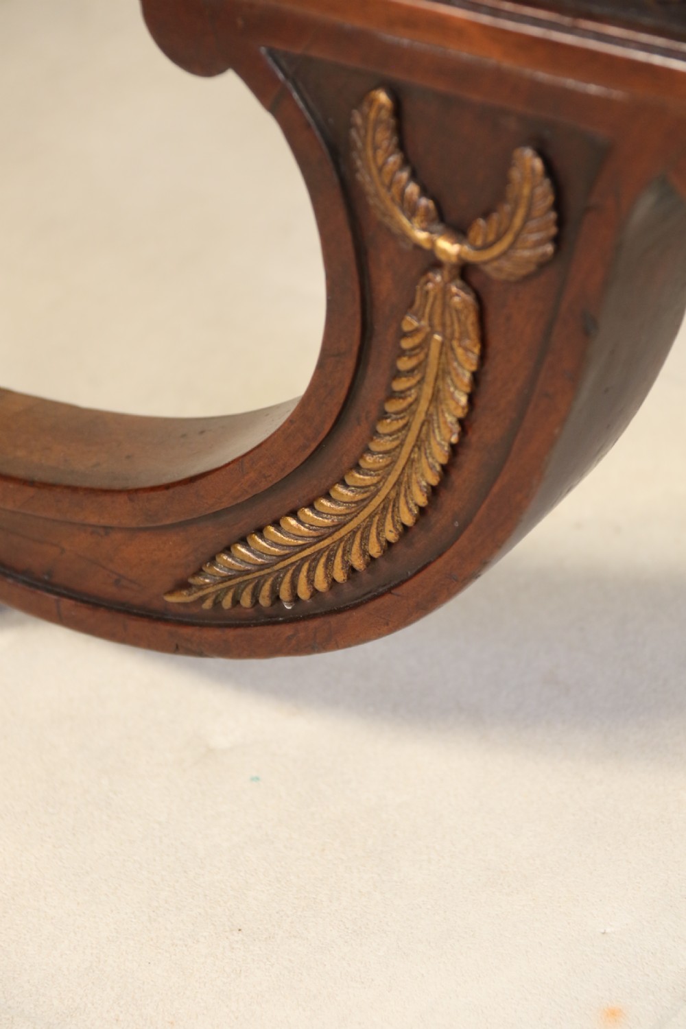 A splendid Regency mahogany and brass mounted deep buttoned leather upholstered chaise lounge View IV
