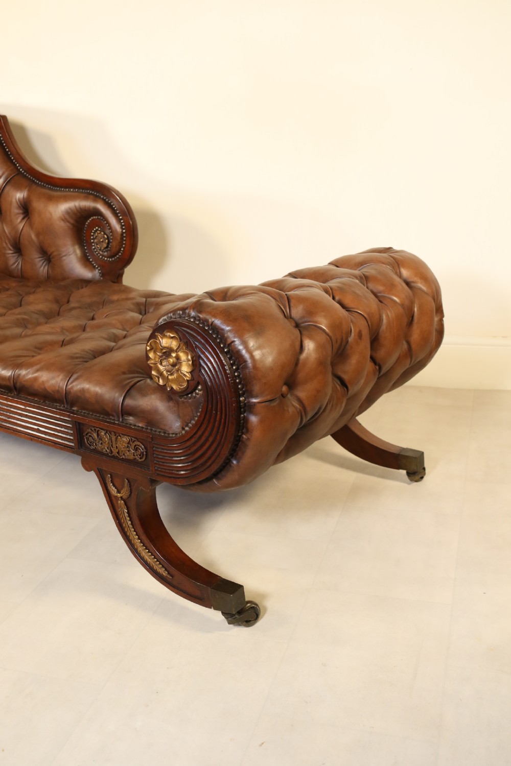 A splendid Regency mahogany and brass mounted deep buttoned leather upholstered chaise lounge View VII