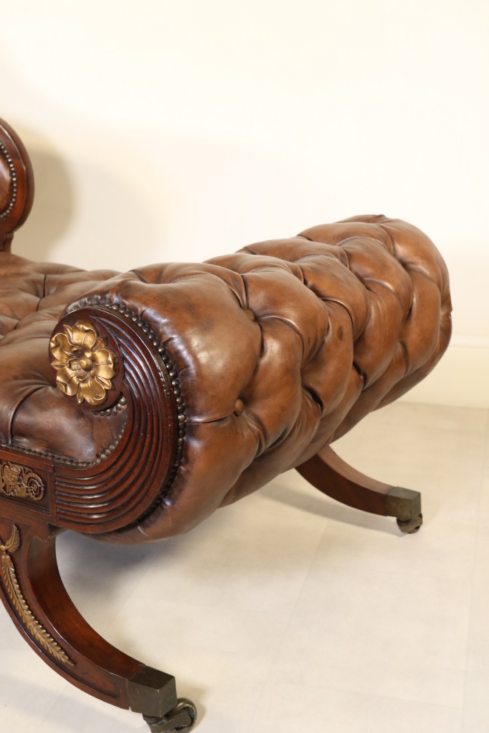 A splendid Regency mahogany and brass mounted deep buttoned leather upholstered chaise lounge View IX