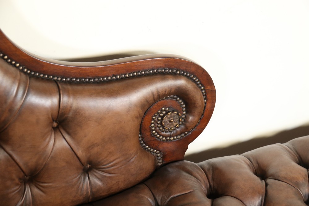 A splendid Regency mahogany and brass mounted deep buttoned leather upholstered chaise lounge View XII