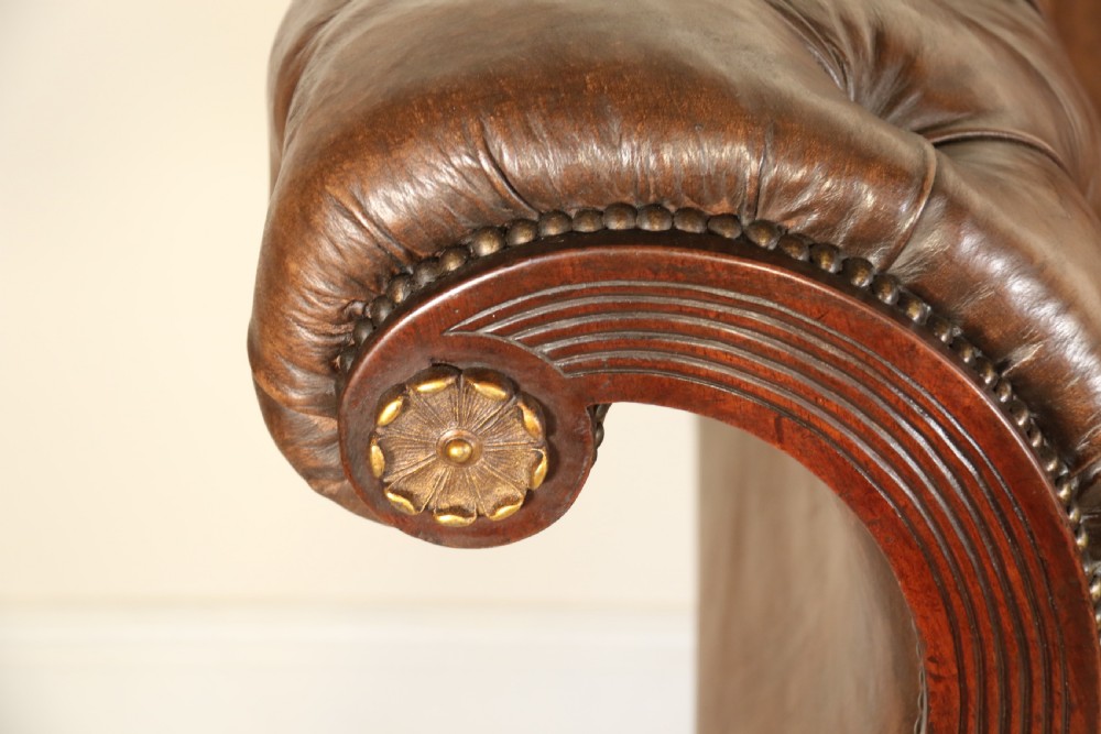 A splendid Regency mahogany and brass mounted deep buttoned leather upholstered chaise lounge View XIII