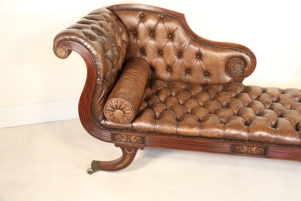 A splendid Regency mahogany and brass mounted deep buttoned leather upholstered chaise lounge View XIV