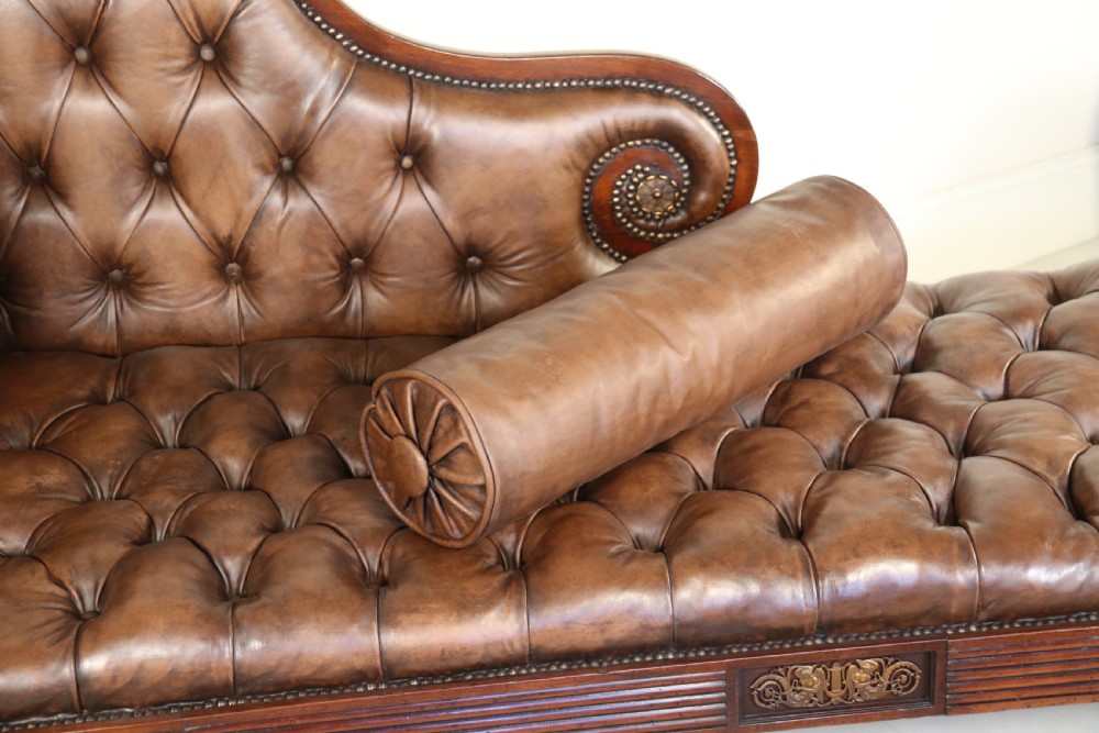 A splendid Regency mahogany and brass mounted deep buttoned leather upholstered chaise lounge View XV