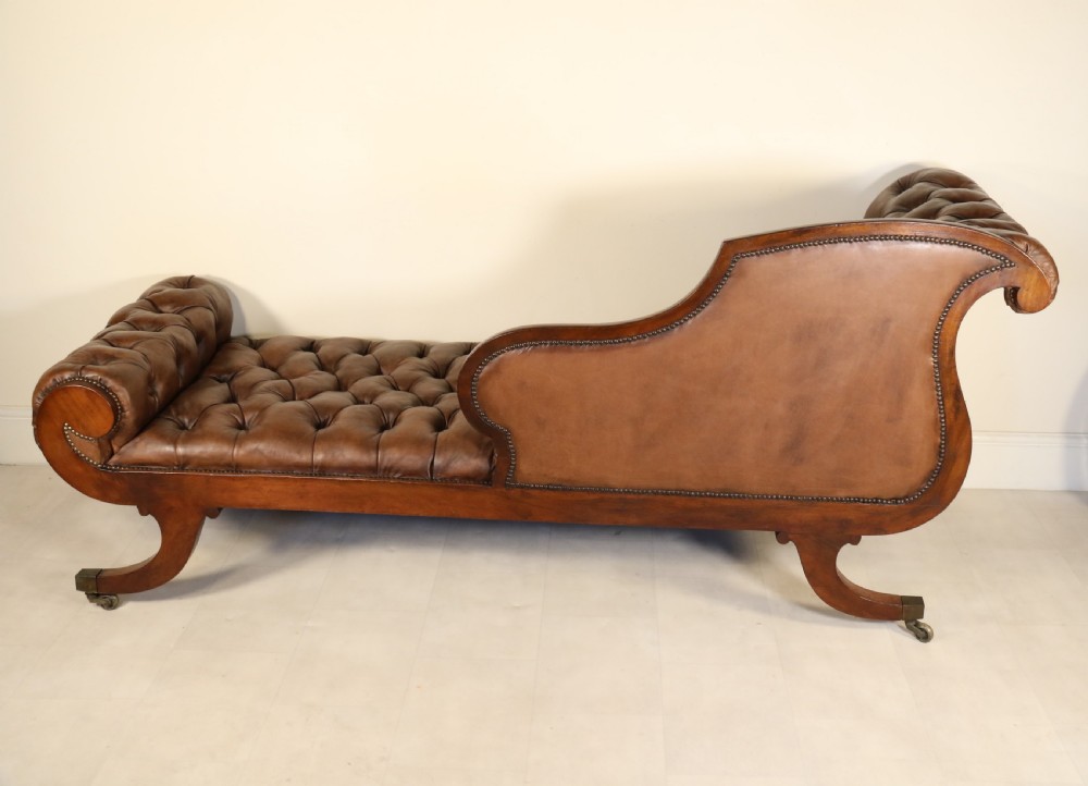A splendid Regency mahogany and brass mounted deep buttoned leather upholstered chaise lounge View XVI