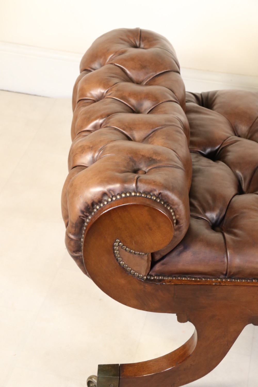A splendid Regency mahogany and brass mounted deep buttoned leather upholstered chaise lounge View XXI