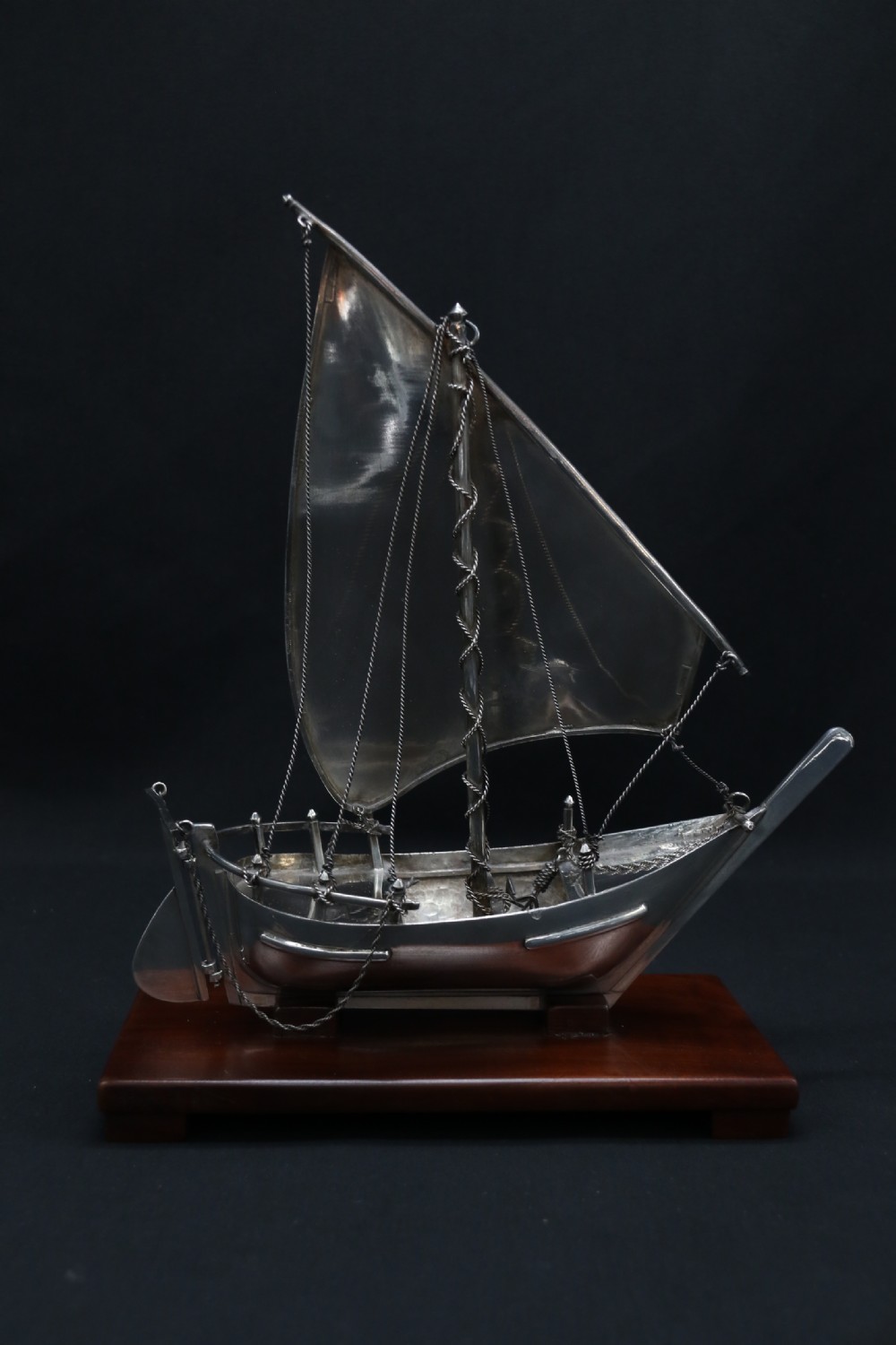 A finely made scale model of a Middle Eastern sailing boat in silver