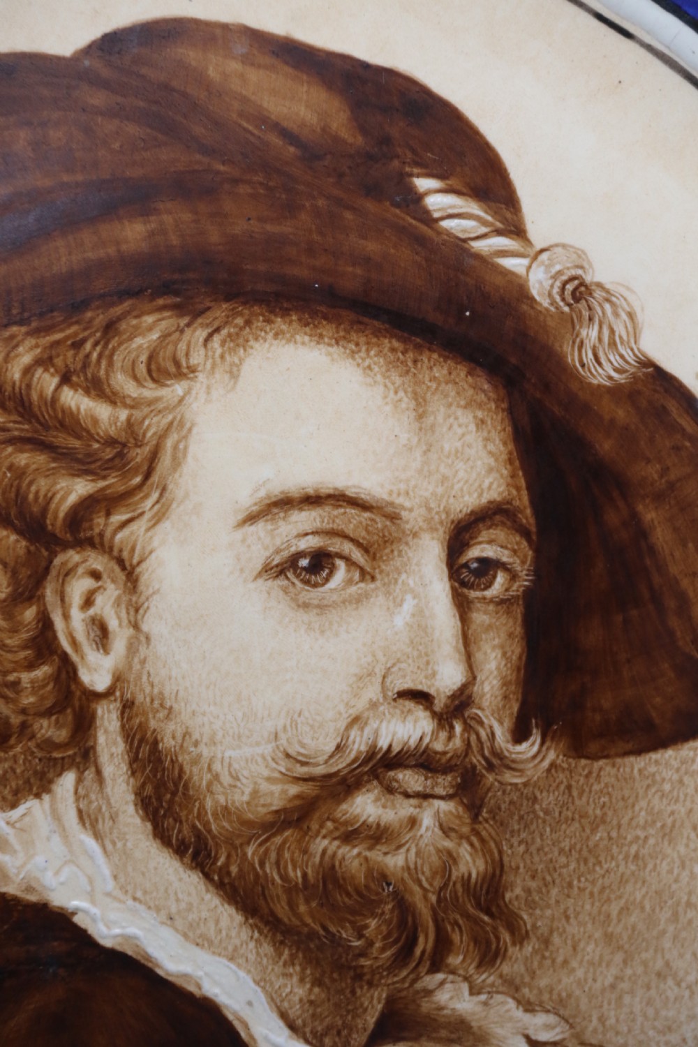 A bold impressive hand painted Continental pottery plaque with a central portrait of Rubens View IV