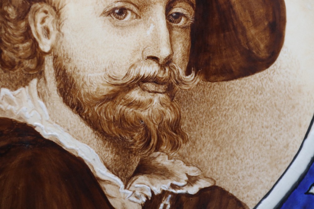 A bold impressive hand painted Continental pottery plaque with a central portrait of Rubens View V