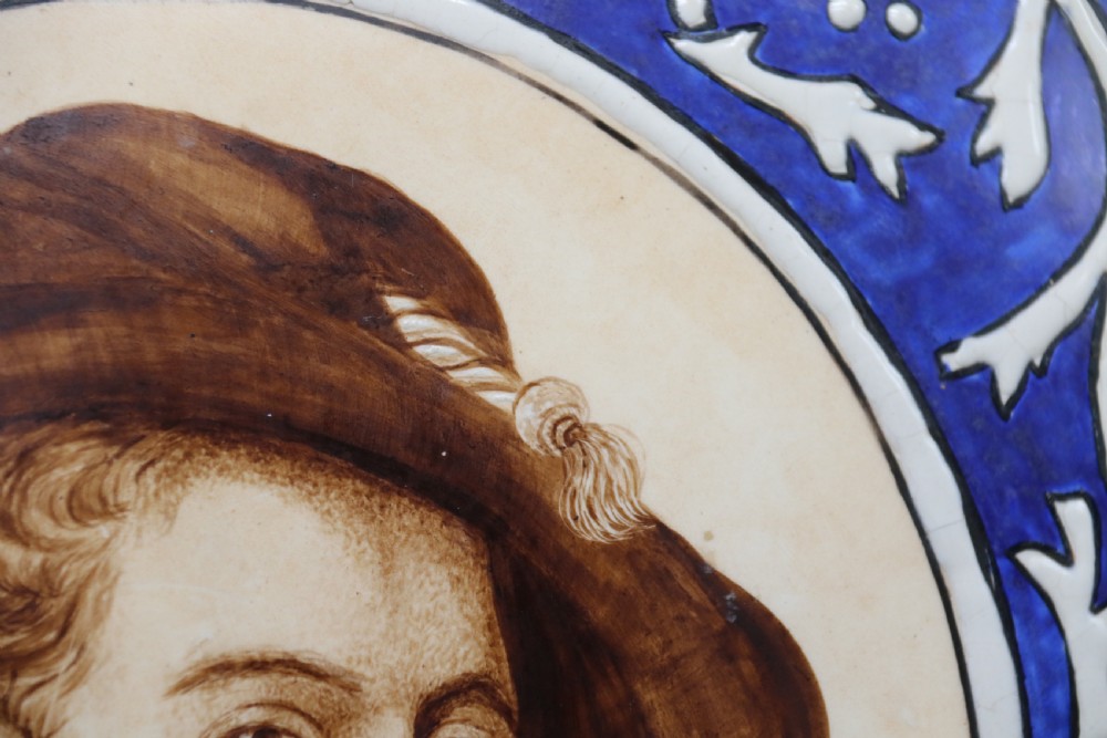 A bold impressive hand painted Continental pottery plaque with a central portrait of Rubens View VI