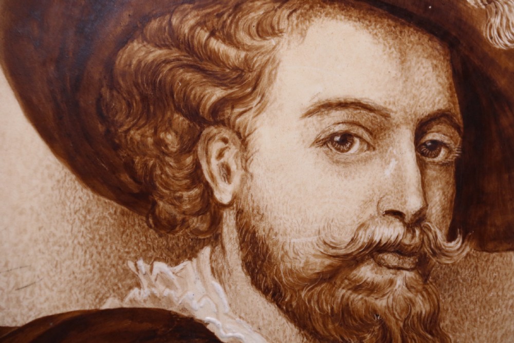 A bold impressive hand painted Continental pottery plaque with a central portrait of Rubens View VIII