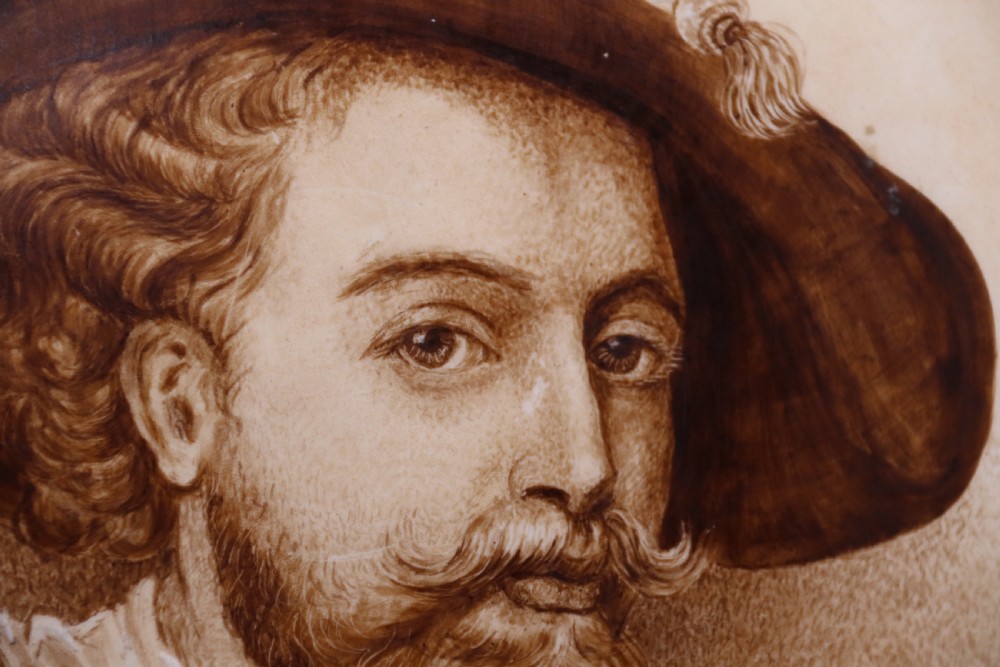 A bold impressive hand painted Continental pottery plaque with a central portrait of Rubens View IX