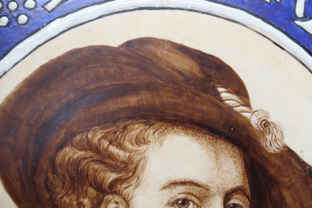 A bold impressive hand painted Continental pottery plaque with a central portrait of Rubens View XVI