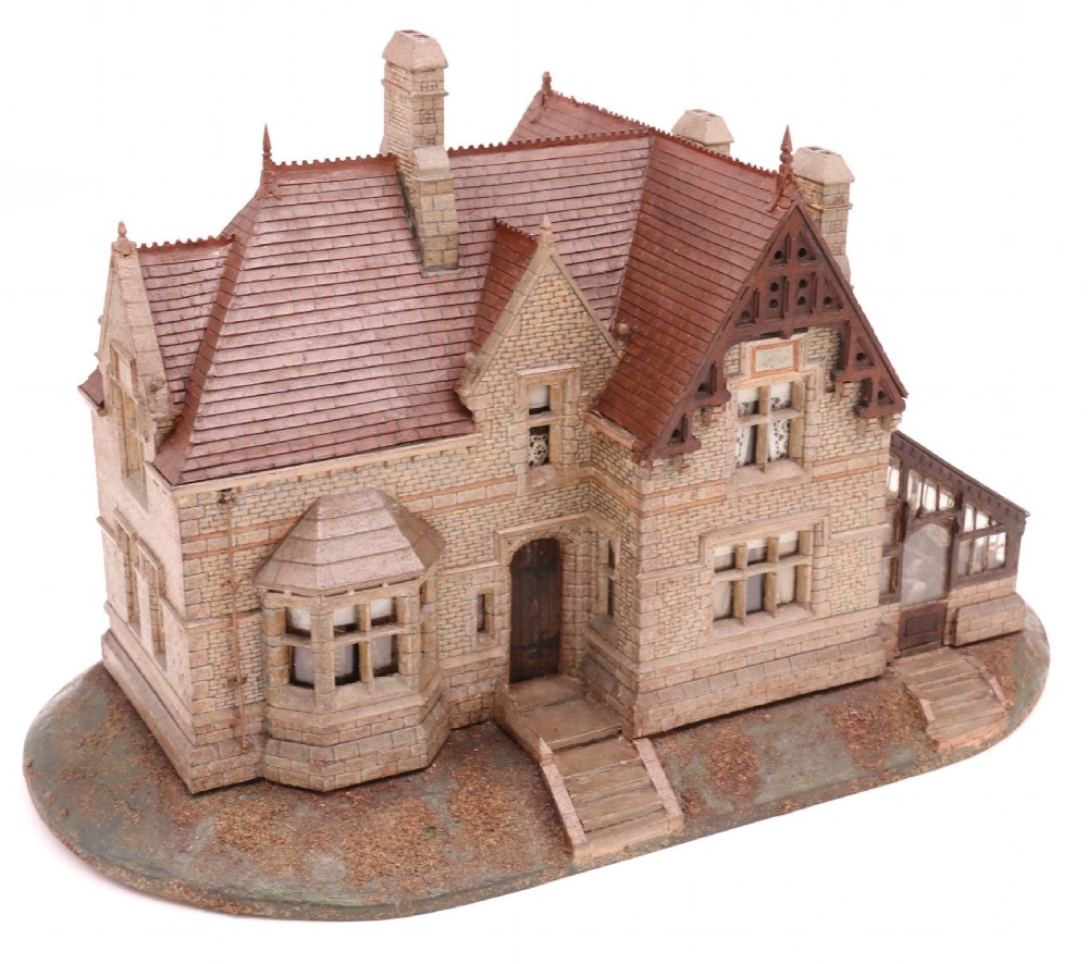 An exceptional Victorian scale model of a Gothic stone house with a glass house diorama 