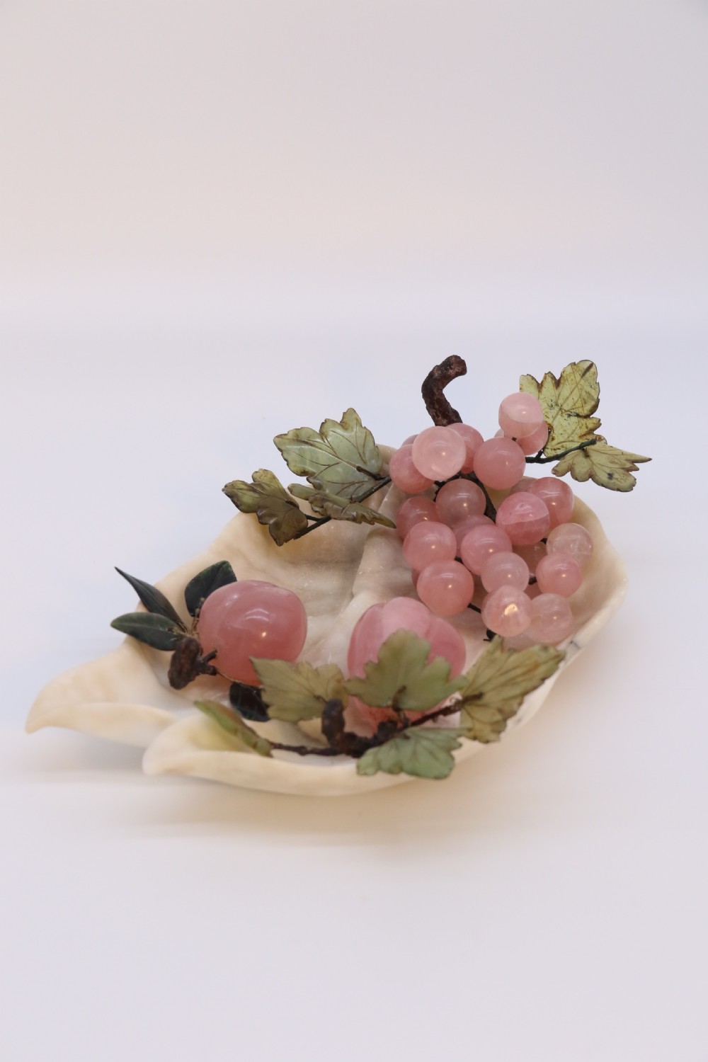 A Chinese hardstone collection of fruit together with a carved alabaster leaf dish View III