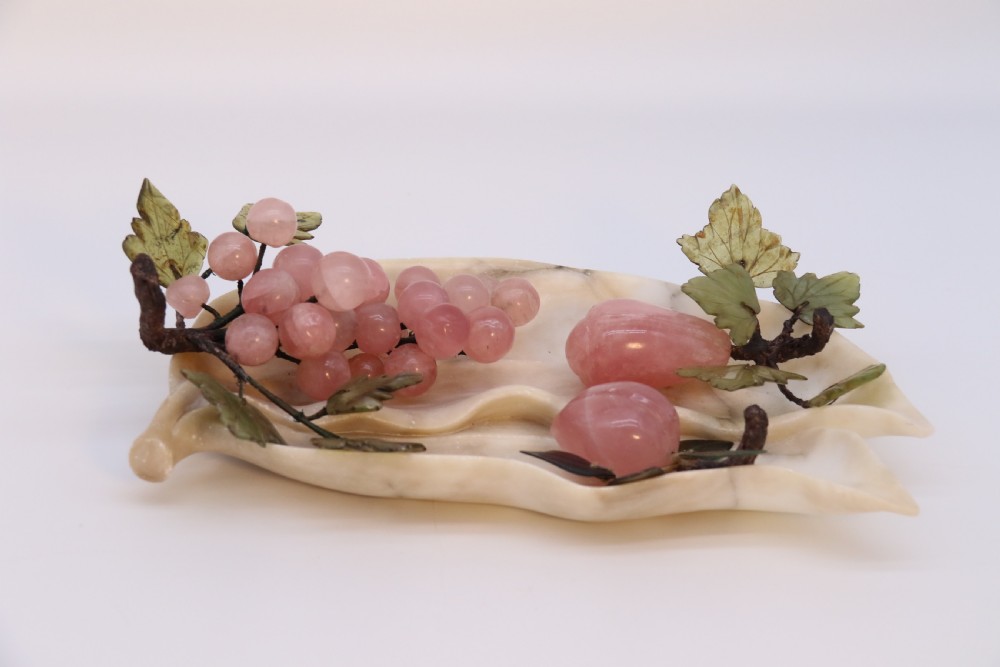 A Chinese hardstone collection of fruit together with a carved alabaster leaf dish View IV