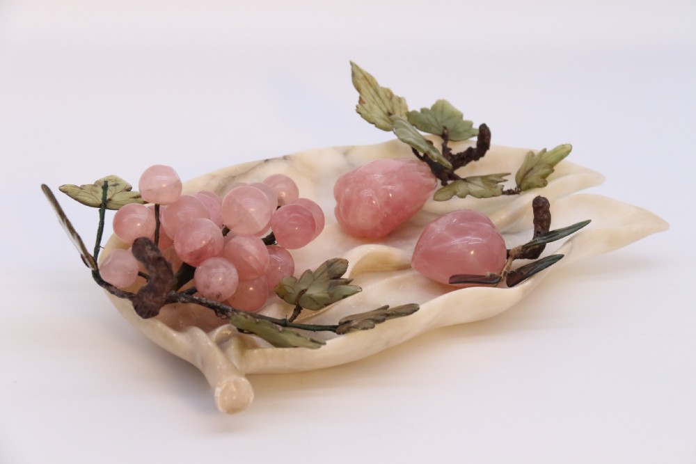 A Chinese hardstone collection of fruit together with a carved alabaster leaf dish View V