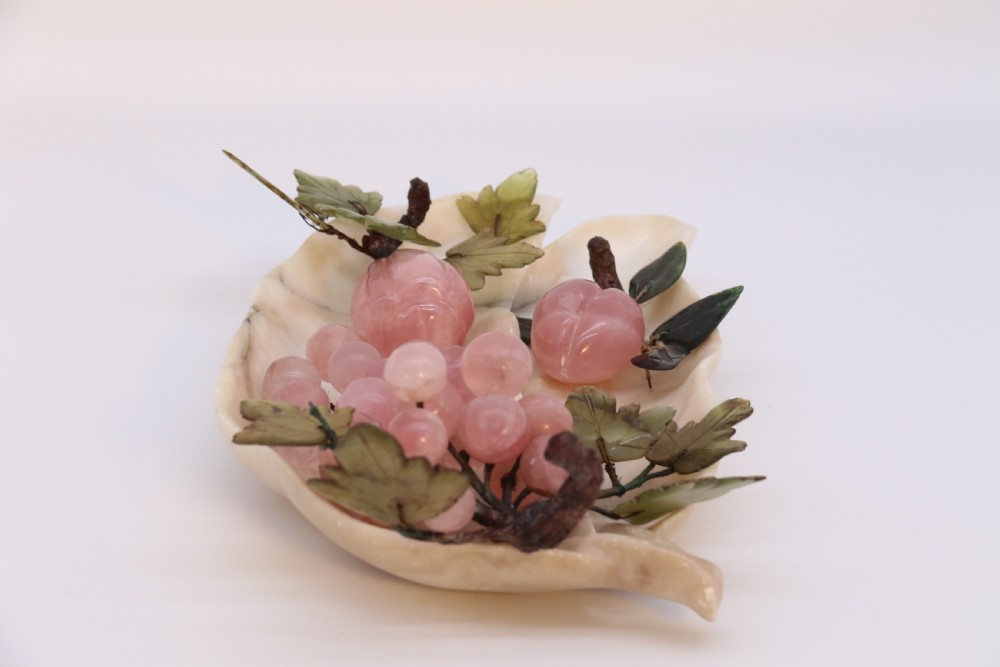 A Chinese hardstone collection of fruit together with a carved alabaster leaf dish View VI