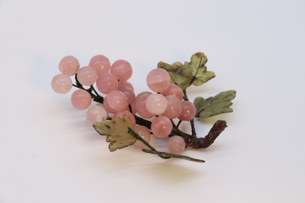 A Chinese hardstone collection of fruit together with a carved alabaster leaf dish View X