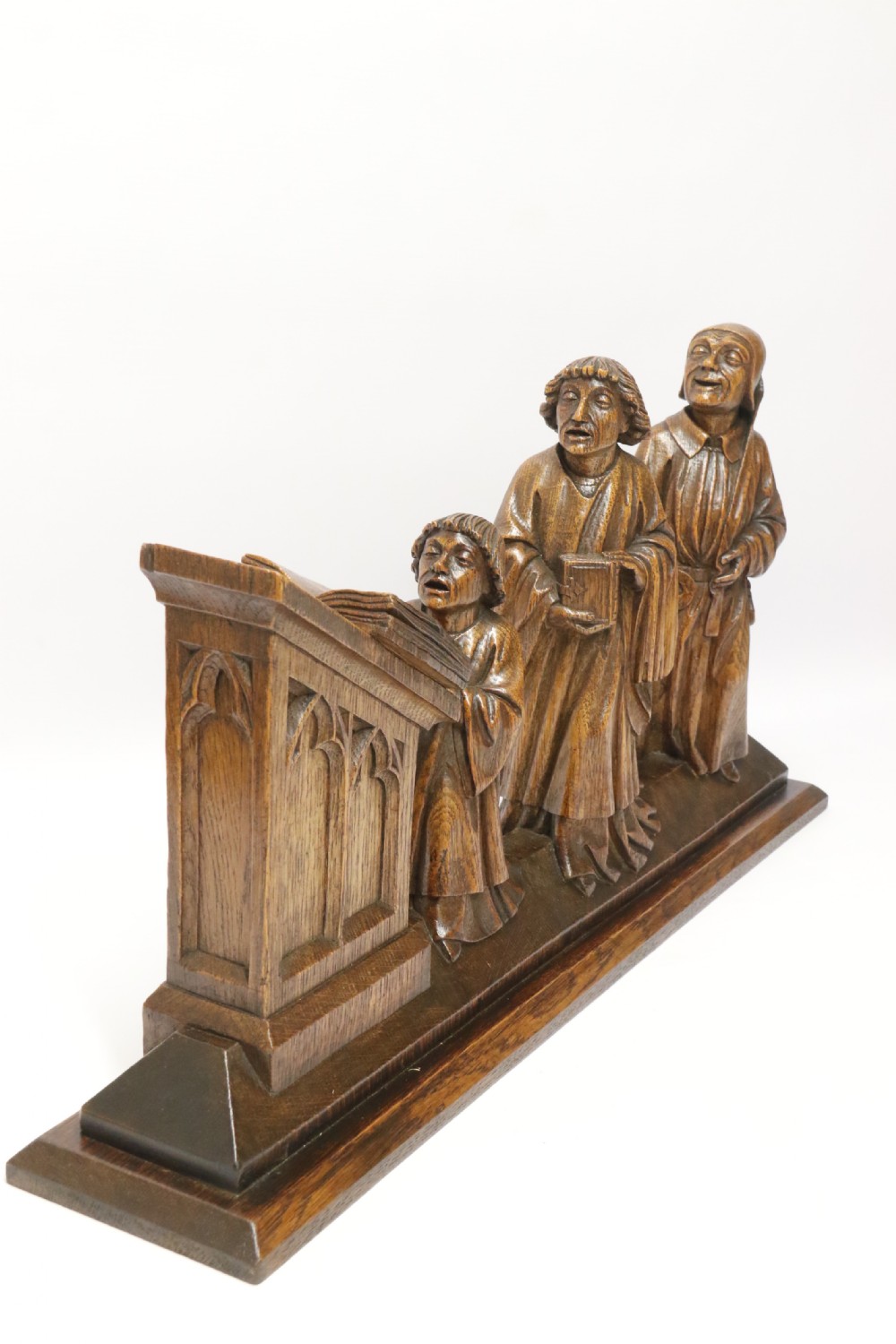 A Fine 19th century Arts and Crafts carved oak figure group of three monks. View II