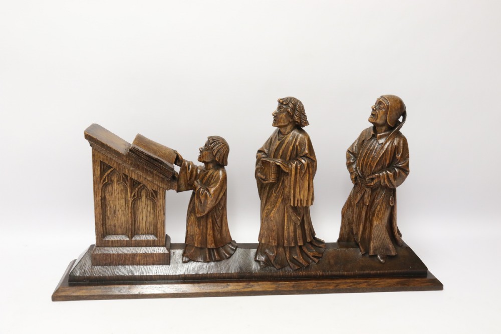 A Fine 19th century Arts and Crafts carved oak figure group of three monks. View VI
