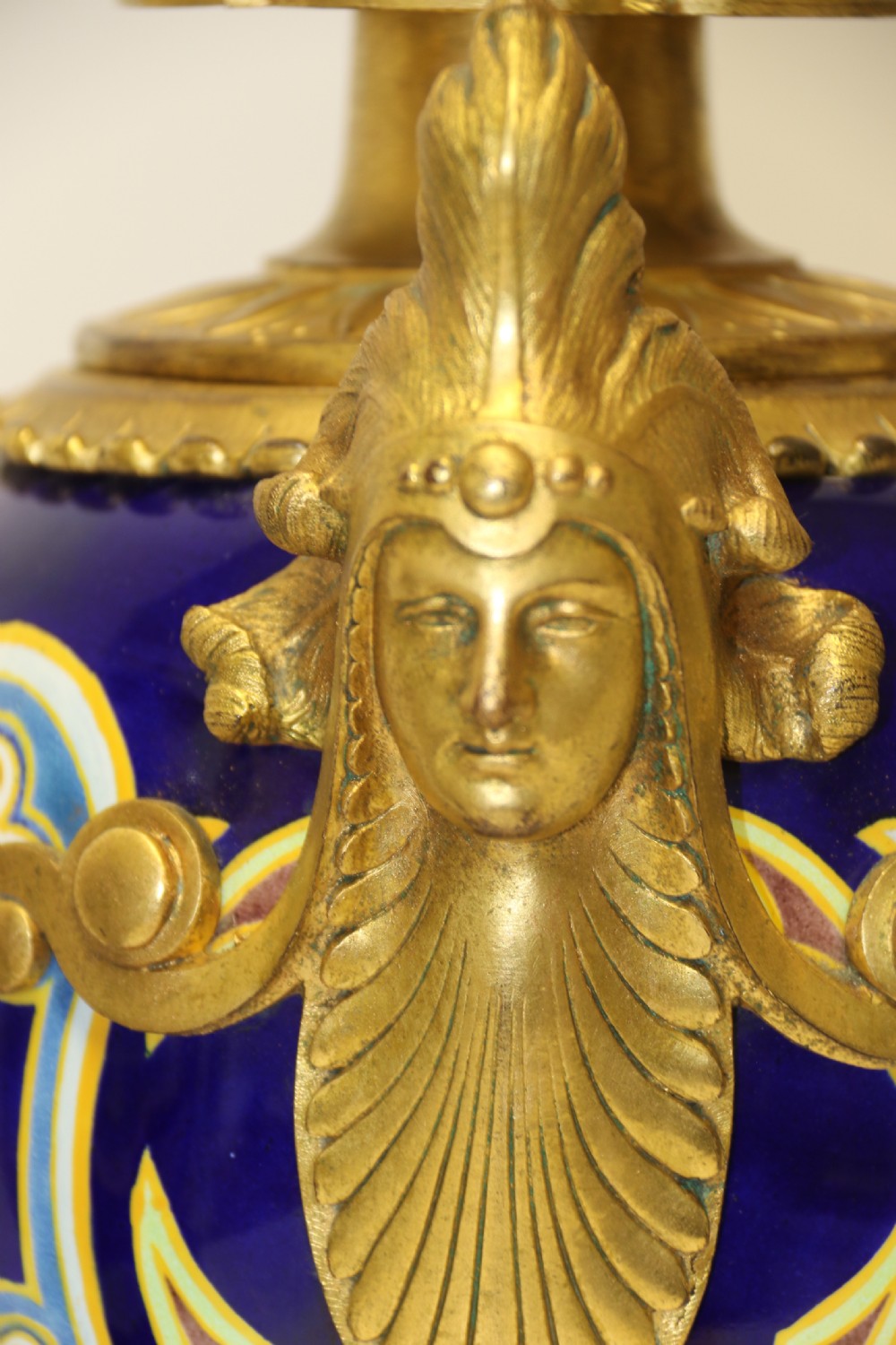A superb pair of gilt bronze and pottery Aztec design vases/ urns View III