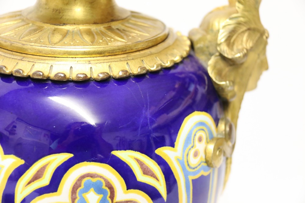 A superb pair of gilt bronze and pottery Aztec design vases/ urns View VII