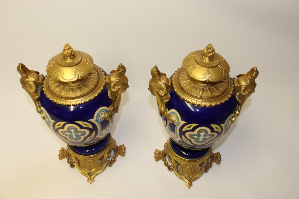 A superb pair of gilt bronze and pottery Aztec design vases/ urns View X