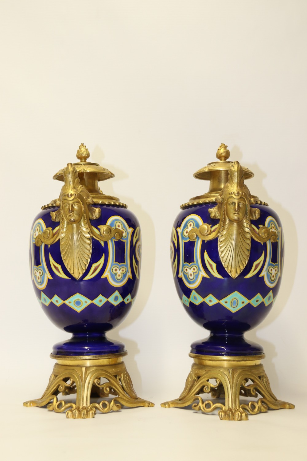 A superb pair of gilt bronze and pottery Aztec design vases/ urns View XXIV