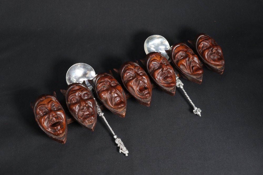 A superb Black Forest spoon rack carved in the devilish faces of the seven deadly sins. View XV