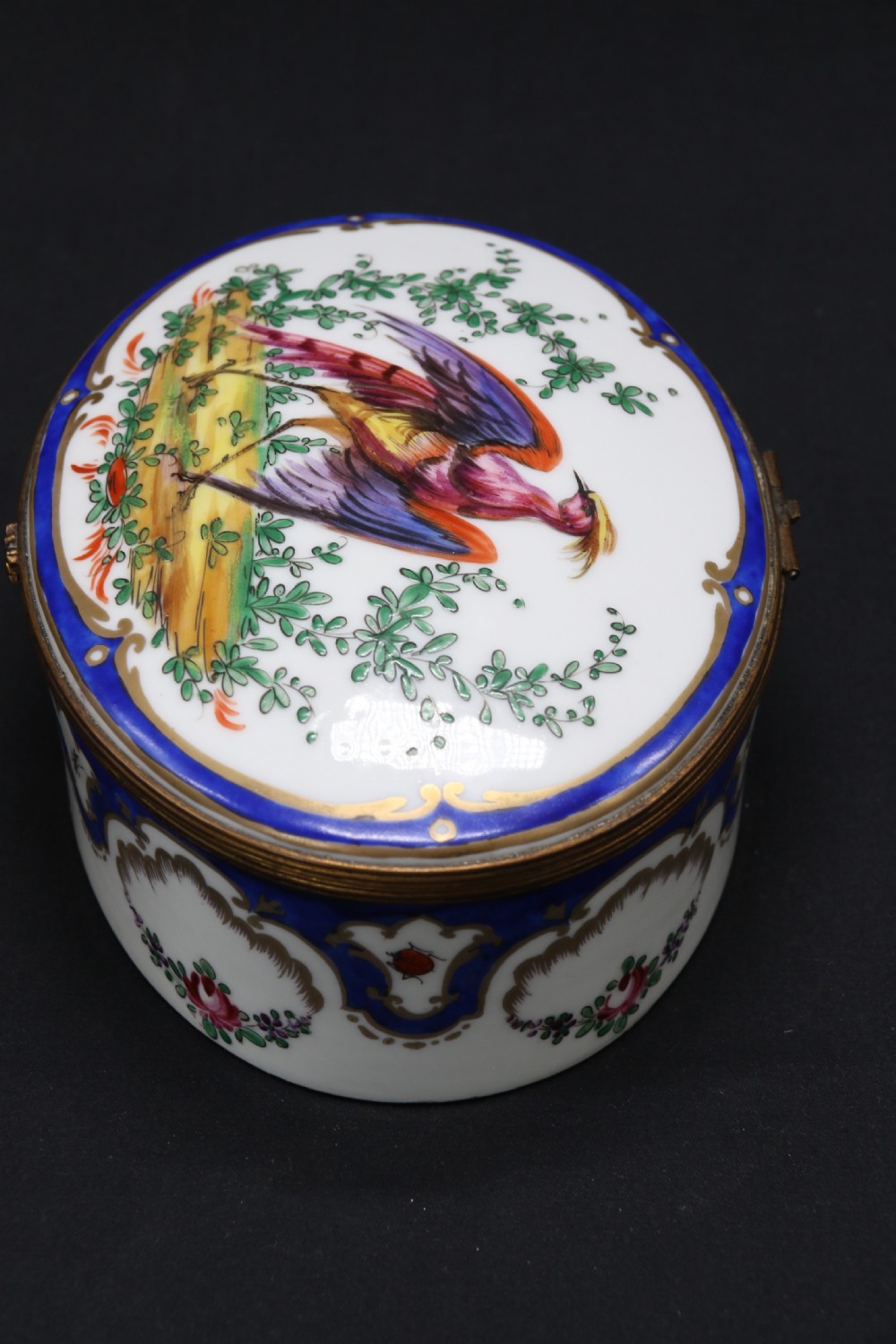 A late 19th century French hand painted porcelain oval box by Samson of Paris View V