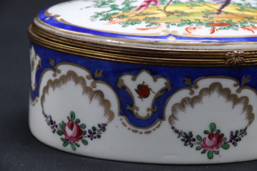 A late 19th century French hand painted porcelain oval box by Samson of Paris View XIII