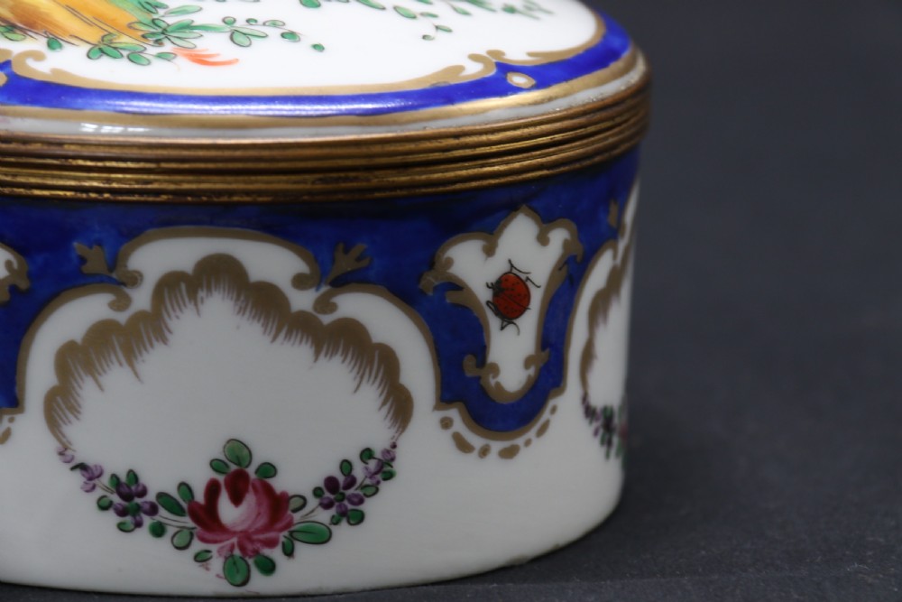 A late 19th century French hand painted porcelain oval box by Samson of Paris View XV