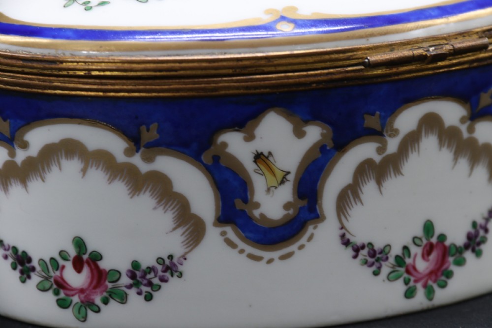 A late 19th century French hand painted porcelain oval box by Samson of Paris View XVI