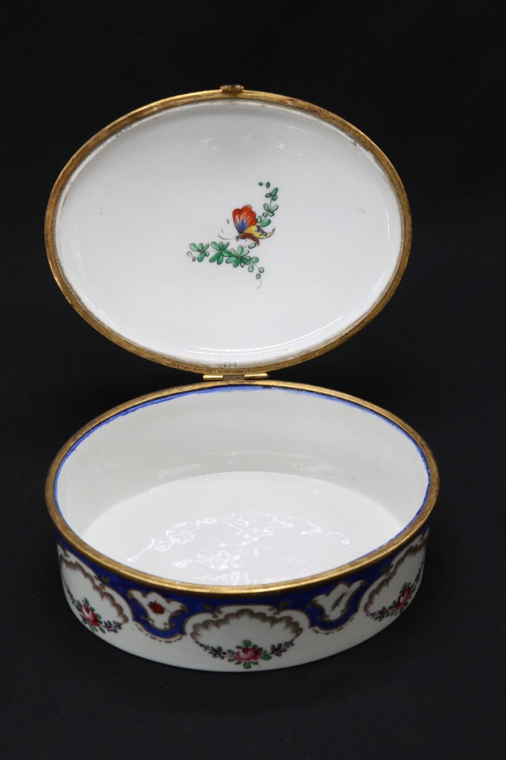 A late 19th century French hand painted porcelain oval box by Samson of Paris View XIX